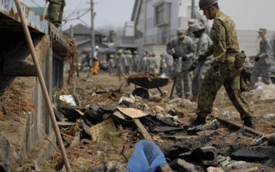 Opposition grows on Okinawa to burning debris from quake Stars and